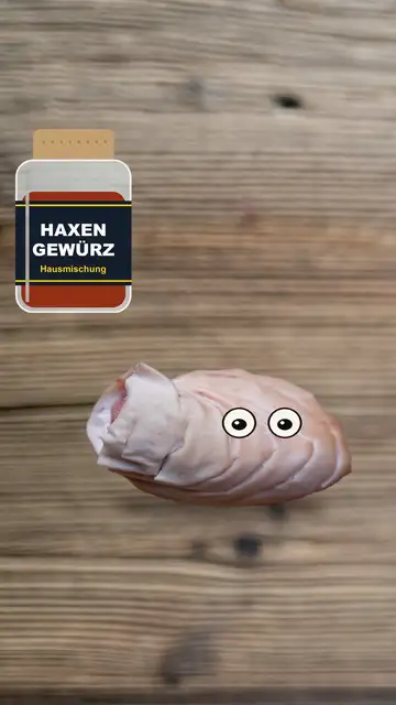 Schweinshaxe mit Augen wird mit Gewürz eingerieben und knusprig